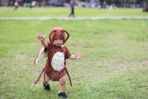Preview: Toddler in cockroach Halloween outfit having fun
