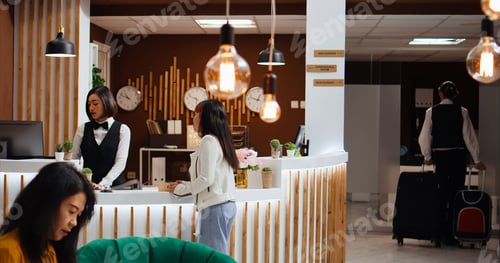Preview: Hotel staff providing luxury concierge services for client