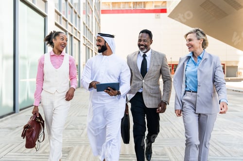 Preview: Group of multiethnic business people meeting an emirati businessman