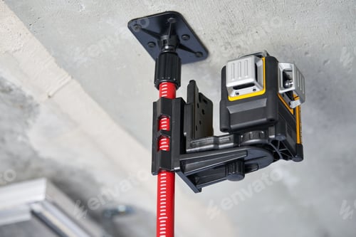 Preview: Laser level measuring tool at construction site or unfinished apartment, close up