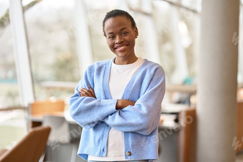 Preview: Happy Black African teen girl student standing in college. Portrait.