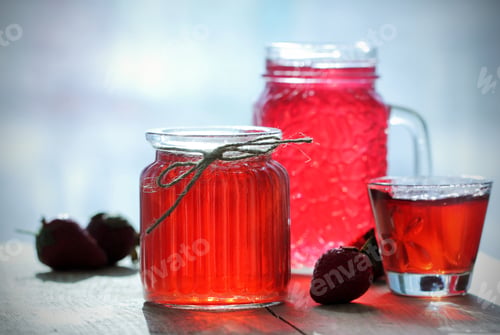 Preview: Jelly Strawberry Stands On A Table In A Pot Near The Paraphernalia And Strawberry