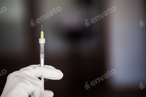 Preview: Syringe. Doctor Prepared Syringe of Vaccine to Injunction Patient
