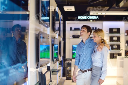 Preview: People In Consumer Electronics Retail Store Looking At Latest Laptop, Television And Photo Camera