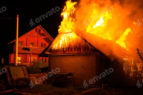 Preview: Wooden house or barn burning on fire at night