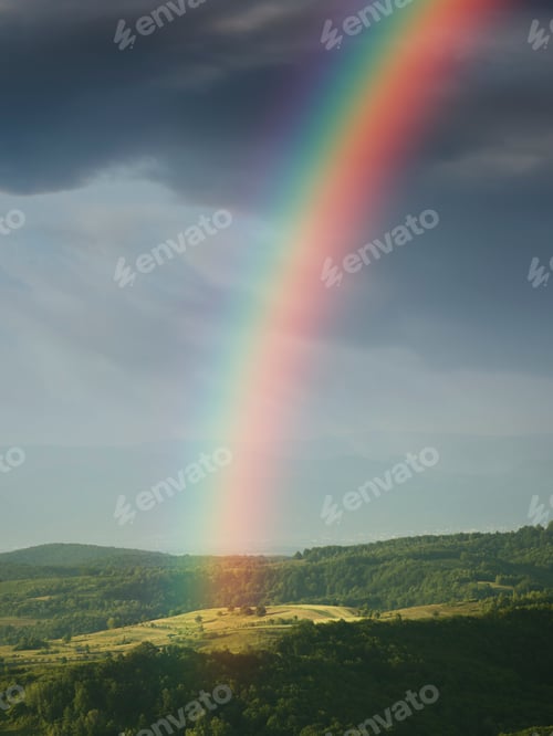 Preview: fantasy landscape with rainbow over the hills