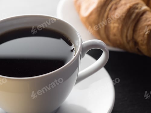 Preview: Cup of coffe and croissants