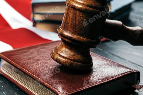 Preview: Image of wooden judge hammer on notepad