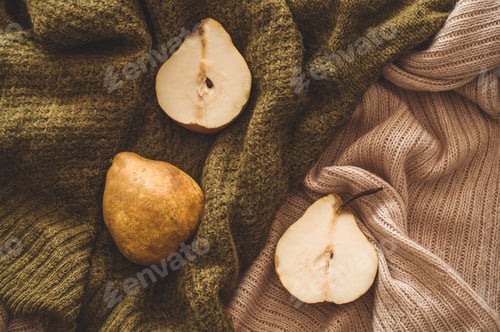 Preview: Autumn nature concept. Fall pears on knitted sweaters. Thanksgiving dinner