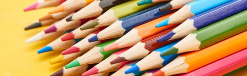 Preview: Sharpened ends of color pencils on yellow background
