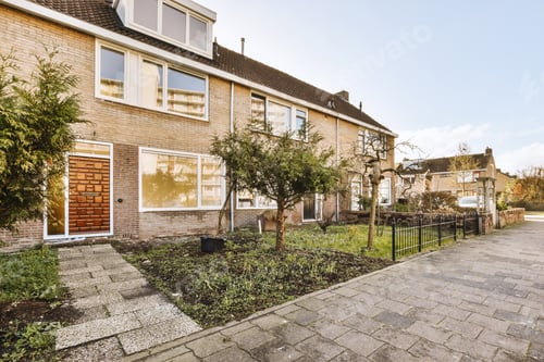 Preview: The facade of a brick building with wooden door