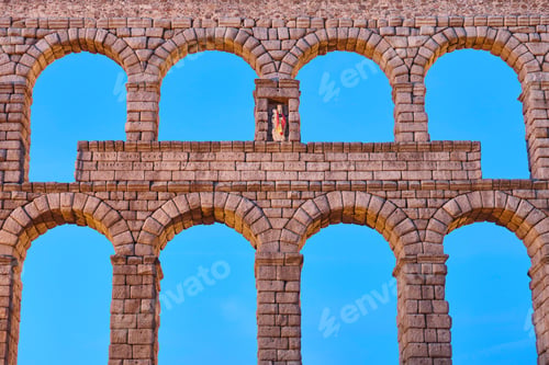 Preview: Roman aqueduct in Segovia at sunset. Ancient engineering work. Spain