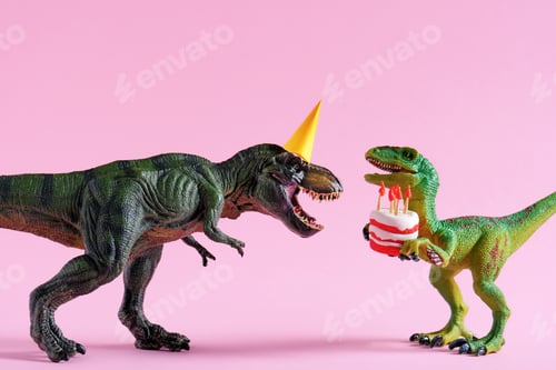 Preview: Cute happy green dinosaurs in birthday hats holding cake with flaming candles on pink background.