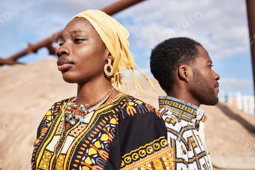 Preview: Traditional African American Couple Standing Back To Back in Desert Sun