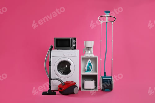 Preview: Set of different home appliances with vacuum cleaner on pink background