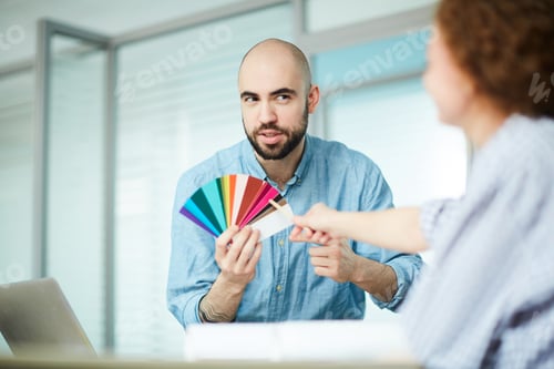 Preview: Bearded designer asking advice of colleague about color combination