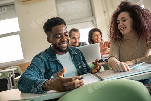 Preview: Couple of students working together on some task.