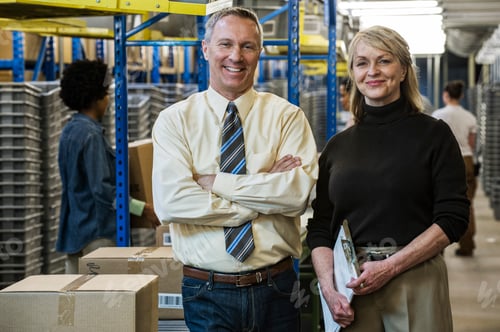 Preview: Portrait of a caucasian male executive in a shirt and tie and a caucasian female executive in