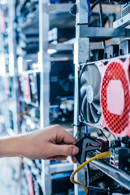 Preview: IT engineer fixing computer server on bitcoin and crypto currency mining farm