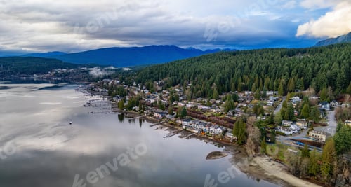 Preview: Residential Homes on the Ocean Shore with mountains in background.