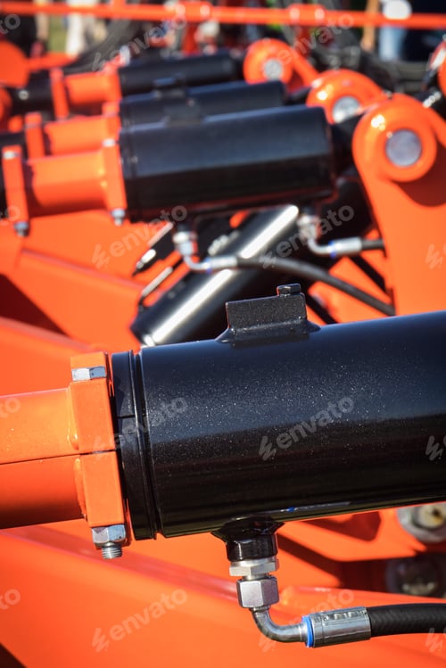 Preview: Black pistons or actuators in red pneumatic or hydraulic machine. Technology