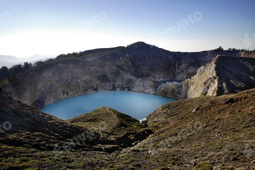 Preview: High panoramic view of the green turquoise colored lake in the Kelimutu volcano early in the morning