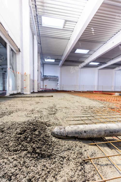 Preview: Concrete screed on floor heating in a new warehouse and office building