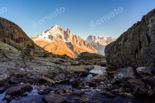 Preview: French alps mountain with stream flowing in rocky valley at Lac Blanc, France