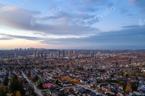 Preview: Aerial View Of Burnaby Suburbs And Vancouver Skyline At Dusk In Greater Vancouver, BC, Canada