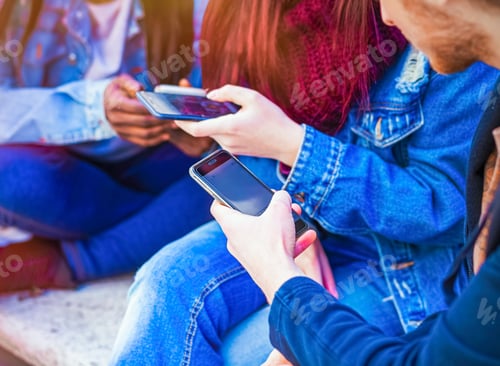 Preview: Three young people using mobile phone