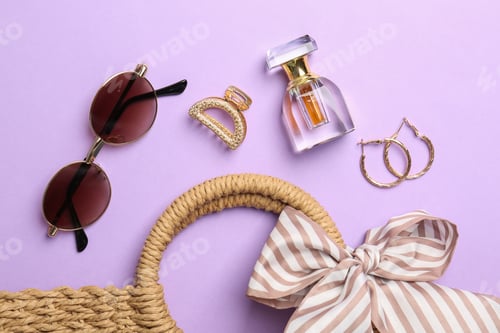 Preview: Bag and stylish accessories on lilac background, flat lay