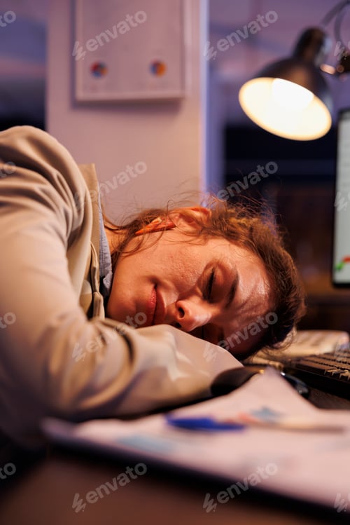 Preview: Overworked exhausted entrepreneur sleeping on desk table