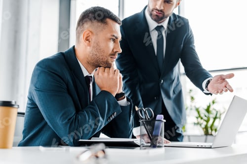 Preview: selective focus of thoughtful business listening coworker in modern office