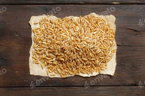 Preview: Pile of Kamut grain on wooden background