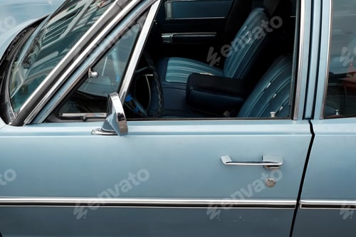Preview: Closeup shot of an old blue vintage car
