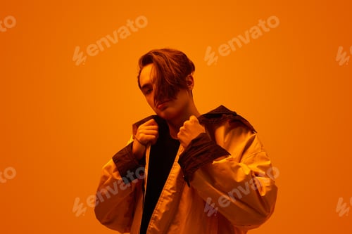 Preview: Cool young guy in stylish clothes in studio