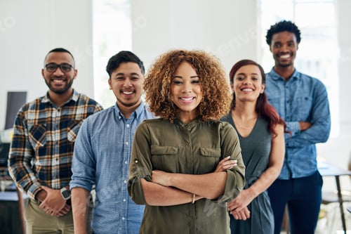 Preview: Portrait of a team of happy and confident colleagues working in a modern office