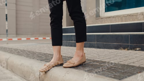 Preview: Asian business woman legs and feet detail in fashion office clothes walking through outdoors.