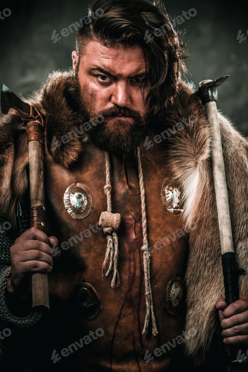Preview: Viking with cold weapon in a traditional warrior clothes