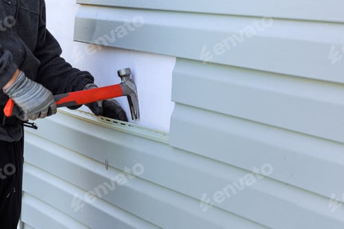 Preview: Reconstruction of exterior of house includes replacement of damaged plastic a siding