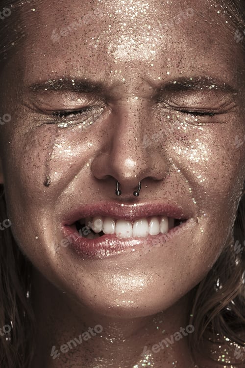 Preview: Portrait of a girl with emotion on her face. An effort