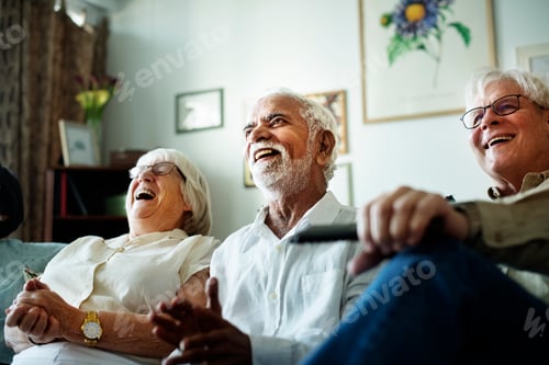 Preview: Senior people watching television together
