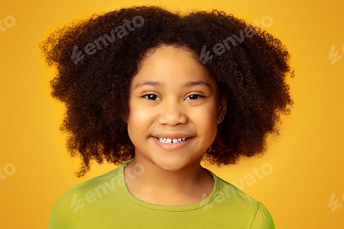 Preview: Positive Cute Black Kid, Little Girl, Posing At Camera And Smiling