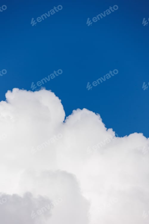 Preview: white cumulus clouds in blue sky, beautiful view of the sky and storm clouds. Huge majestic cloud