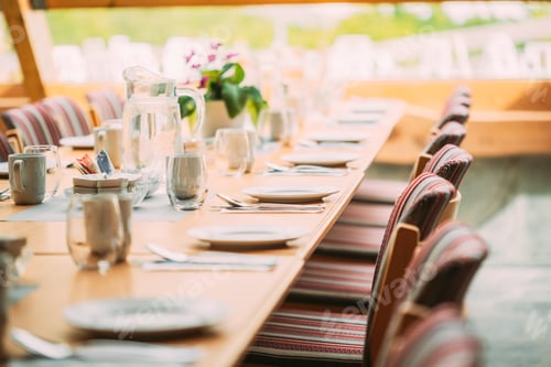 Preview: Cozy Interior Of Summer Cafe. Table And Cutlery Laid Out
