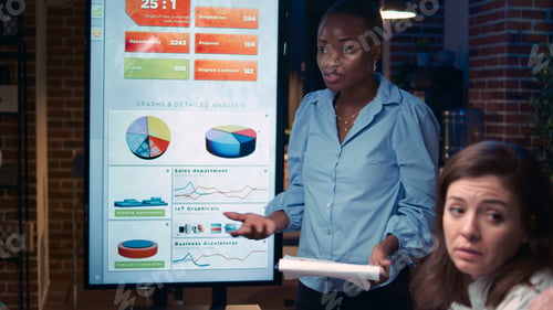 Preview: Employee speaking in business meeting presentation, holding report clipboard