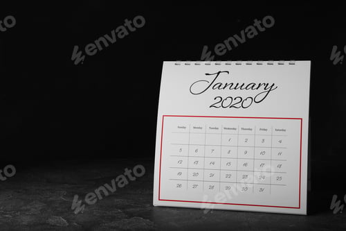 Preview: Paper calendar on grey table, space for text. Planning concept