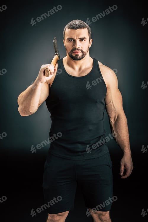 Preview: portrait of confident sportive man holding axe isolated on black