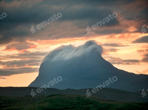 Preview: Low cloud rolling over top of Stac pollaidh mountain at dusk, Assynt, Scotland, UK