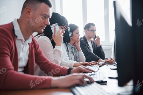 Preview: Communication with customers. Young people working in the call center. New deals is coming